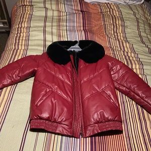 Red jacket with the fur on its neck